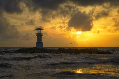Scenic view of sea against cloudy sky
