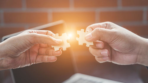 Close-up of man holding hands