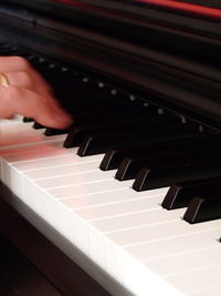 Close-up of hands playing piano