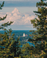 High angle view of buildings and sea against sky