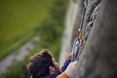 Close-up of man rock climbing