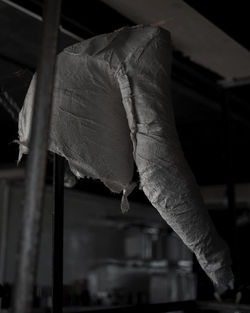Close-up of clothes hanging on built structure