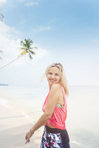 Woman enjoying at beach during summer