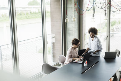 People working on table at home