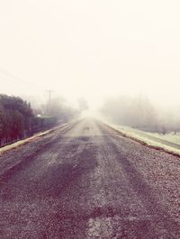 Road against sky during foggy weather