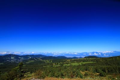 Scenic view of mountains against clear blue sky