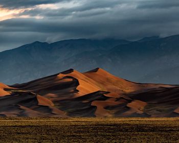 Scenic view of landscape and mountains against sky