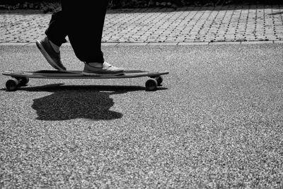 Low section of man on road