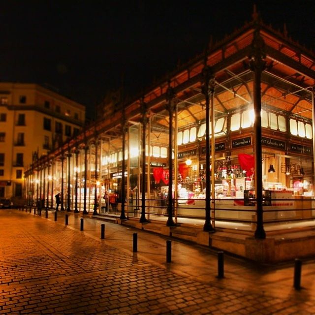 illuminated, night, architecture, built structure, building exterior, city, text, street, city life, incidental people, lighting equipment, store, outdoors, transportation, large group of people, street light, road, non-western script, multi colored, western script