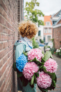 Young woman holding bouquet