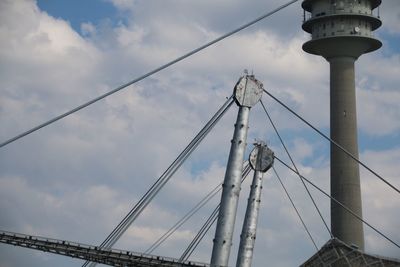 Low angle view of suspension bridge against sky