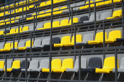 Empty plastic colored seats in stadium without spectators. close-up. water arena.
