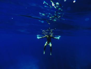 Underwater view of hands in water