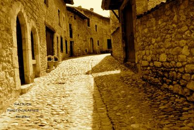 Footpath amidst buildings