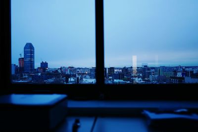 View of cityscape against blue sky