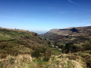 Scenic view of landscape against clear blue sky