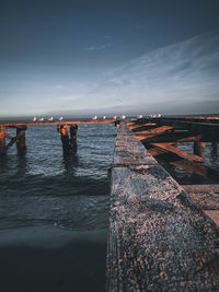 Pier over sea against sky