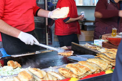 Man preparing food on barbecue grill