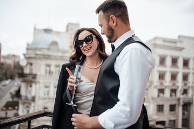 Young couple standing in city