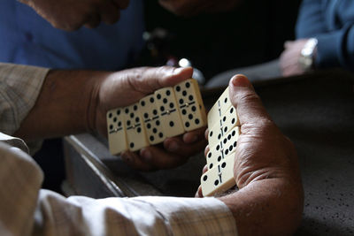 Close-up of man playing leisure game