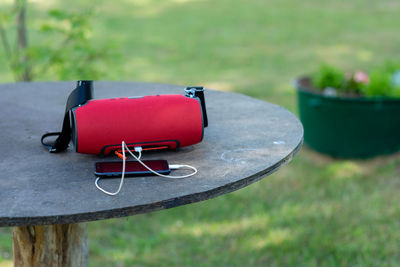 Close-up of red wine on table at field