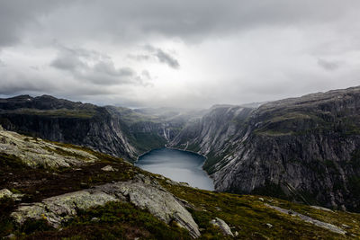 Scenic view of waterfall against sky