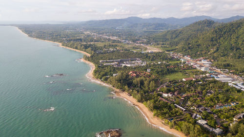 High angle view of sea and mountains against sky