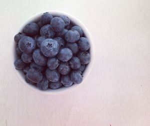 High angle view of grapes in bowl on table