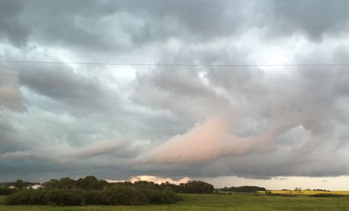 Scenic view of landscape against cloudy sky