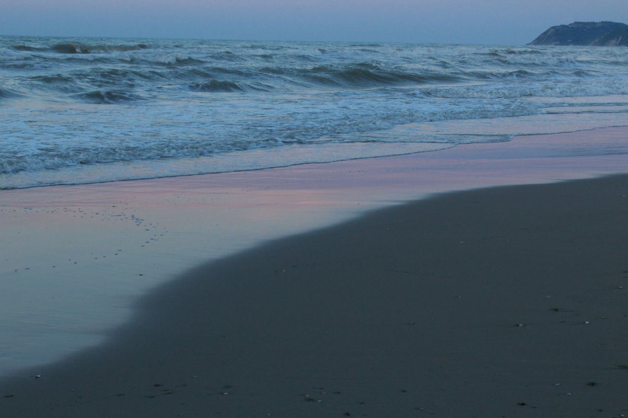 sea, beach, horizon over water, water, shore, sand, tranquility, tranquil scene, scenics, beauty in nature, wave, nature, coastline, sky, surf, idyllic, calm, outdoors, remote, day