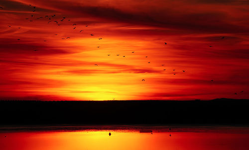 Scenic view of dramatic sky during sunset