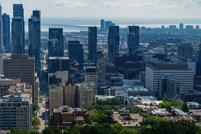 High angle view of buildings in city against sky