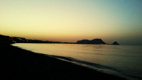 Scenic view of sea against clear sky during sunset