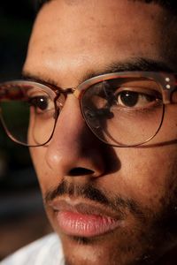 Close-up of man wearing eyeglasses