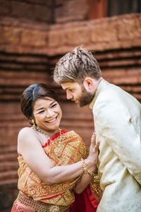 Young couple standing outdoors