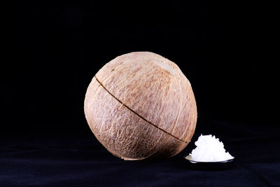 Close-up of apple against black background