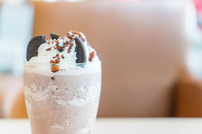 Close-up of ice cream in glass on table