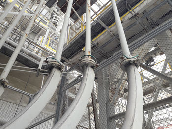 Low angle view of staircase amidst buildings in city