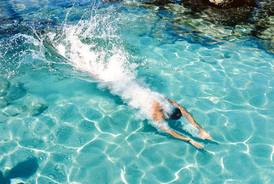 High angle view of man swimming in river