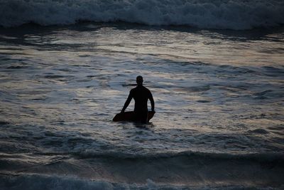 Silhouette man on beach