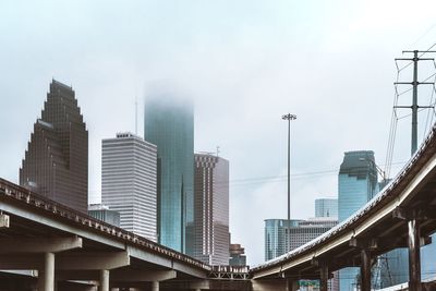 Low angle view of modern buildings against sky in houston