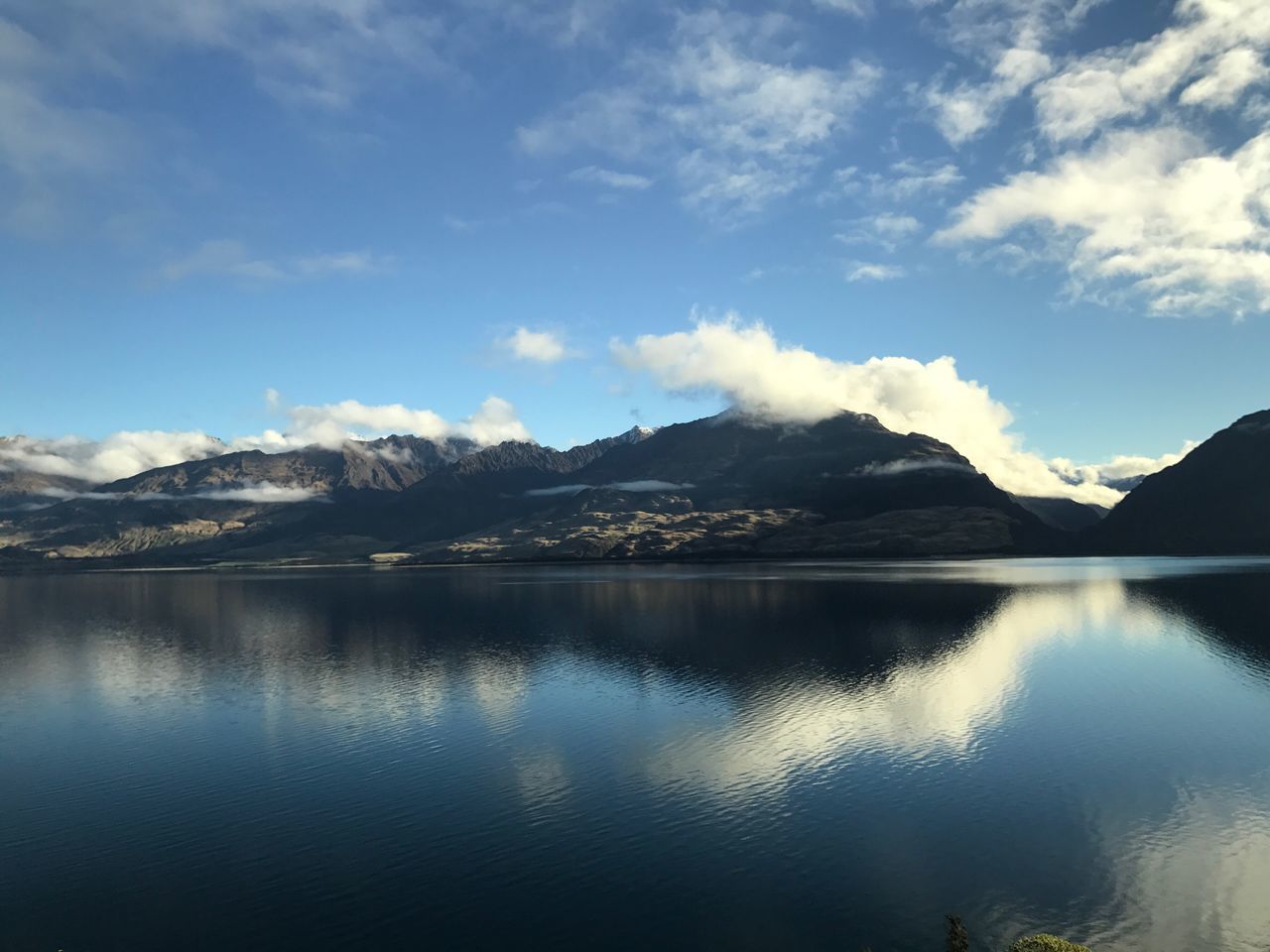 mountain, beauty in nature, lake, reflection, nature, water, scenics, sky, waterfront, tranquility, outdoors, no people, tranquil scene, day, mountain range, cloud - sky, landscape, iceberg