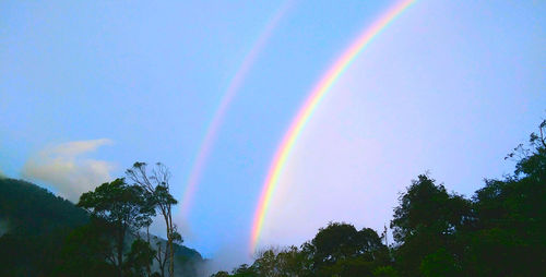 Low angle view of rainbow against sky