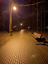 Empty footpath in park at night