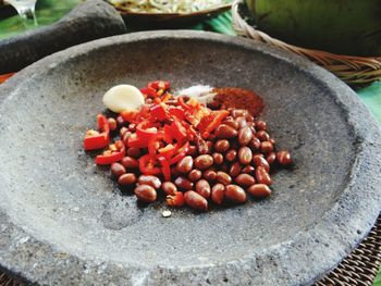 Peanuts on mortar and pestle