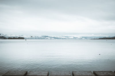 Scenic view of sea against sky during winter