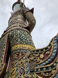 Low angle view of statue against sky