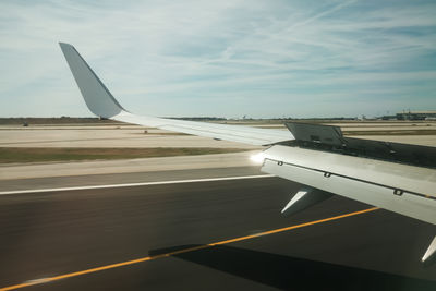 Cropped image of airplane wing