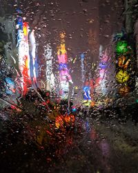 Raindrops on glass window during rainy season