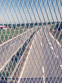 Highways seen through chainlink fence